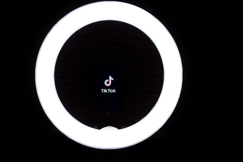 TikTok logo inside a ring light. 