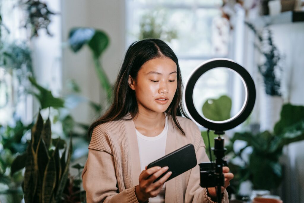 woman filming video for best time to post on tiktok