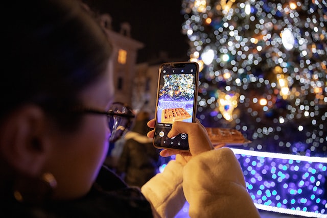 Woman taking a video with her phone for TikTok.