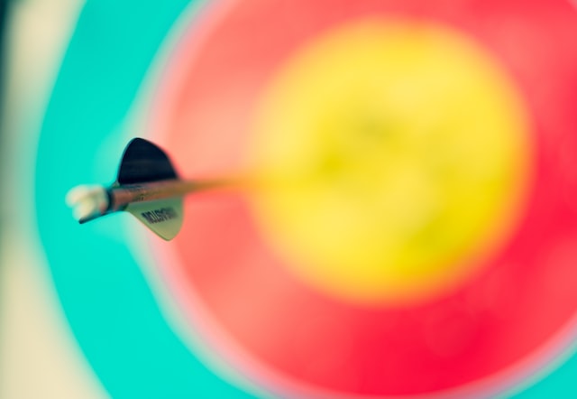 A dart hitting a bull's eye representing precise audience targeting to grow your TikTok following.