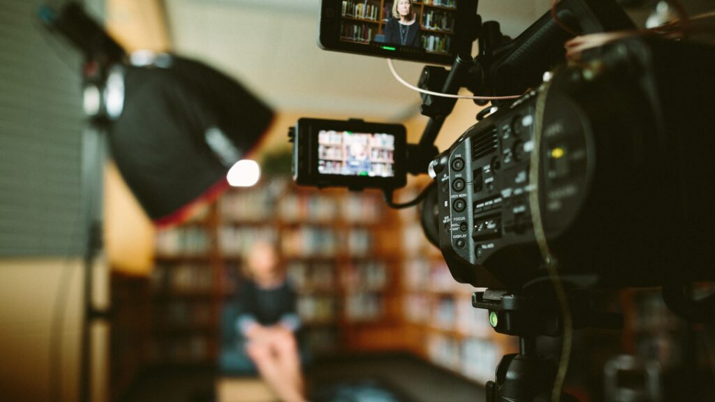 Woman in a library getting ready to go live on TikTok.