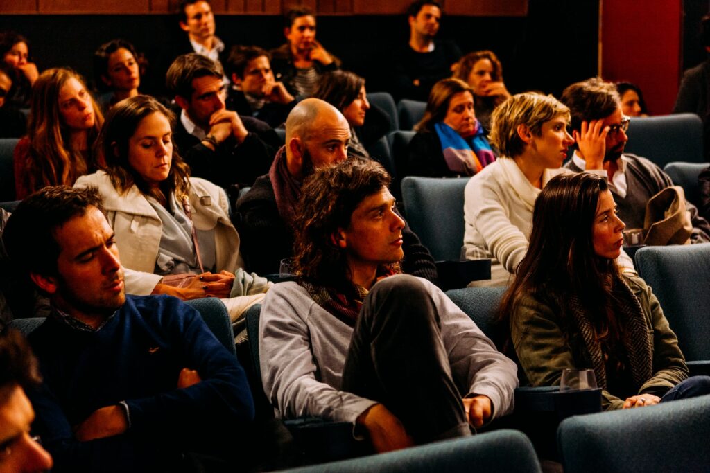  An audience listening to a speaker. 