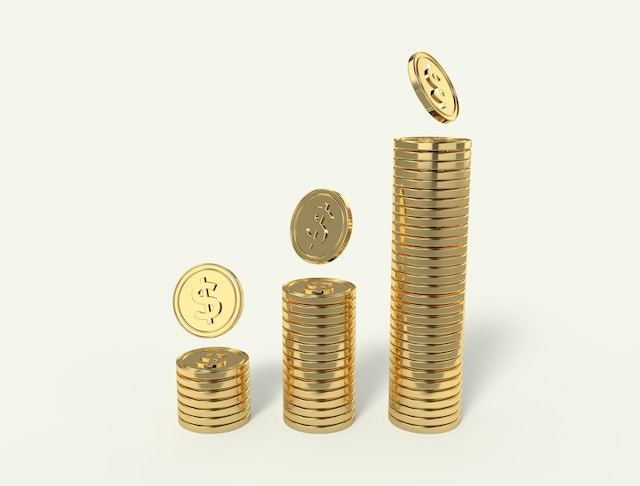 Three stacks of gold coins. 