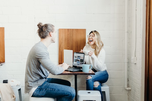 A man and woman laughing.