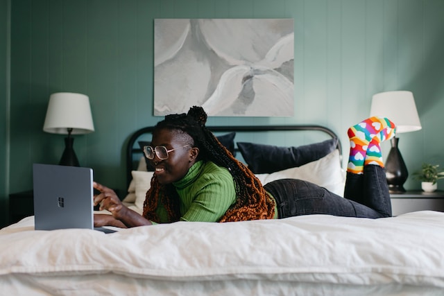 A girl watching a TikTok video on her laptop.