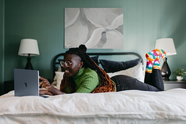  A girl watching a TikTok video on her laptop.