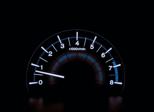 An analog tachometer.