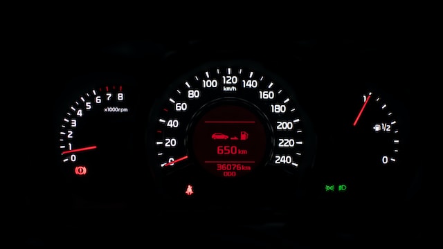 Car dashboard displaying an instrument panel cluster. 
