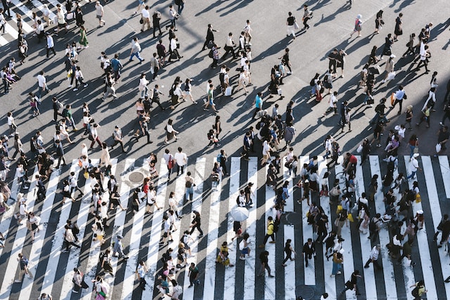 People walking in a major thoroughfare. 