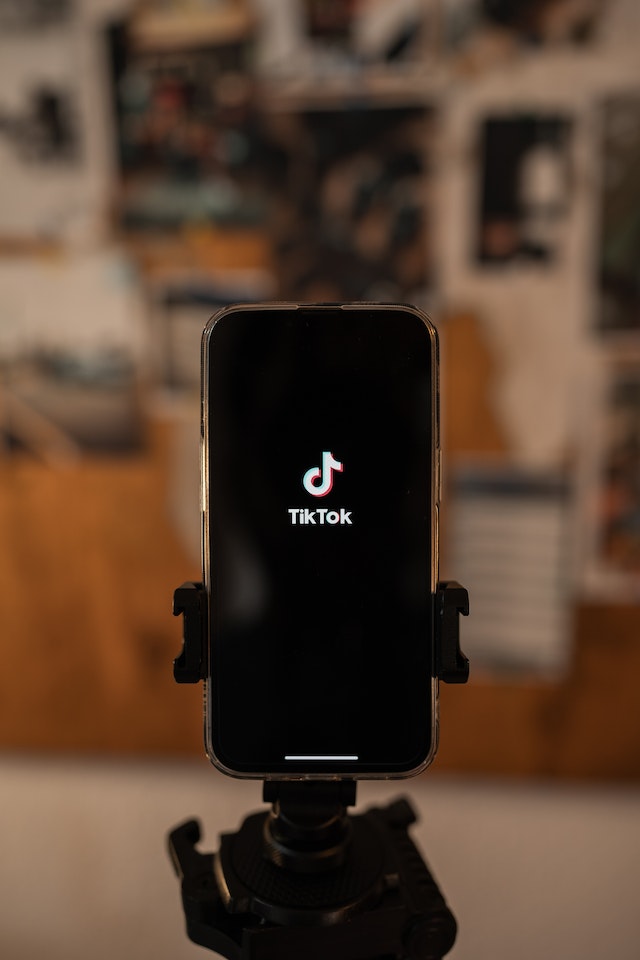 The TikTok app opens on a smartphone screen. 