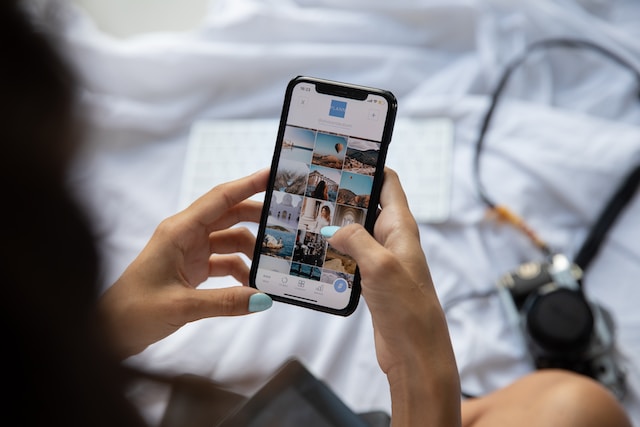 A woman browsing her photos and videos in her camera roll. 