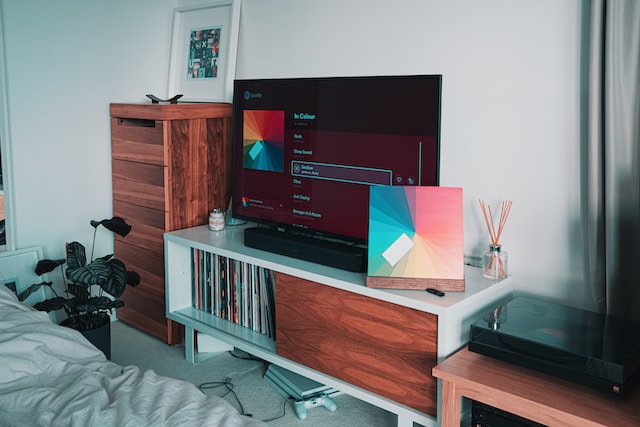 A big smart TV in a bedroom. 
