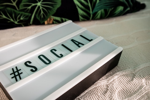 Letter tiles for a sign spelling “#Social”.