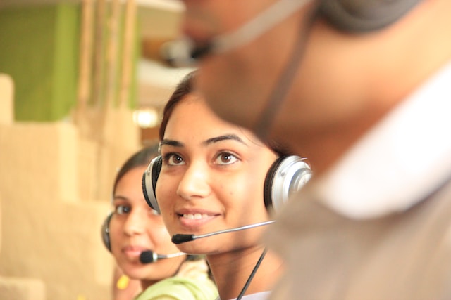 A group of people wearing headsets.
