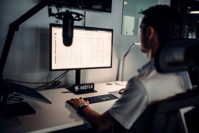 A man editing sounds on a computer.