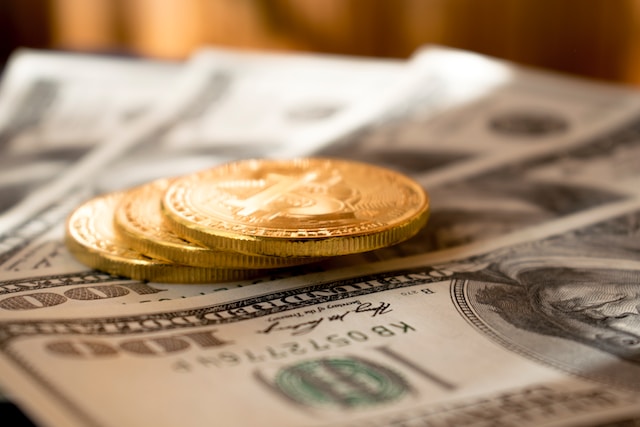 Coins on top of dollar bills.