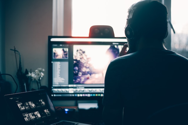 A person editing photos on his laptop. 
