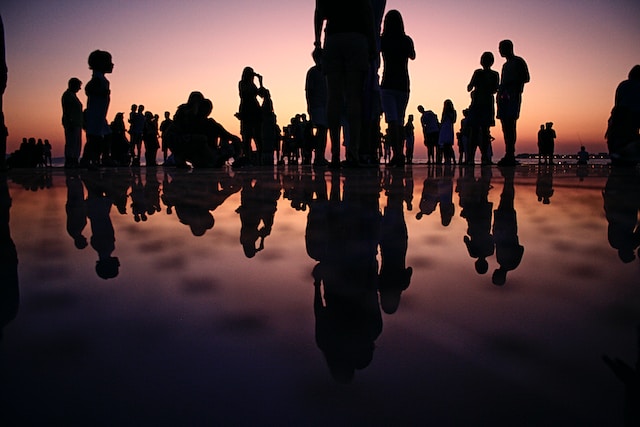 Silhouettes of people at the beach.