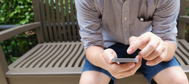 An user adding captions to his TikTok videos via his smartphone.