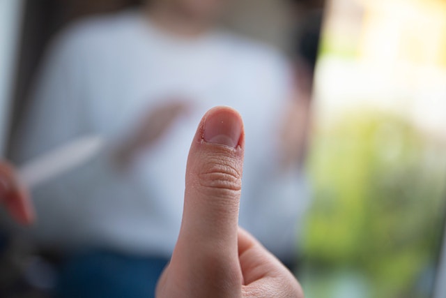 A close view of a person’s thumb.