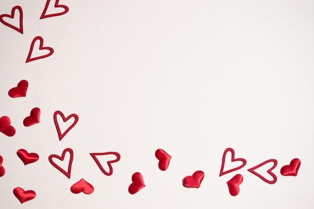 Multiple mini red hearts symbolizing TikTok likes.