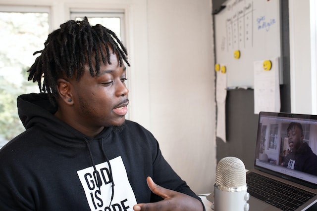 A male tech influencer creating a DIY video.