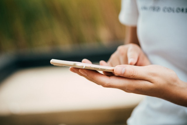 A user trying to access the TikTok analytics tool on her mobile phone.