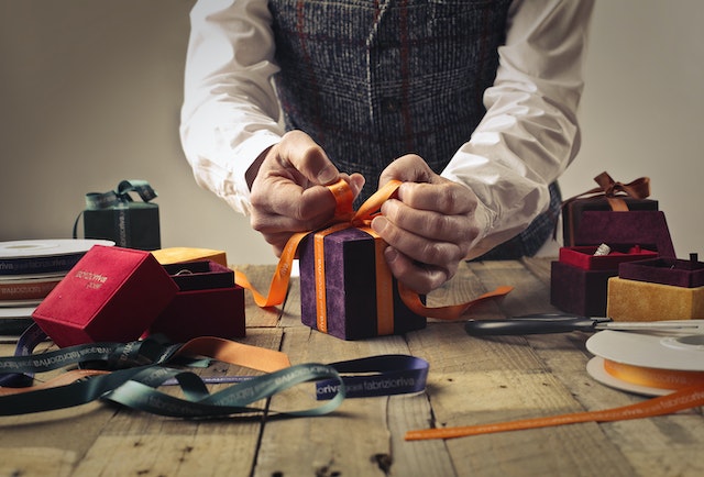 A person wraps boxes for a TikTok giveaway.