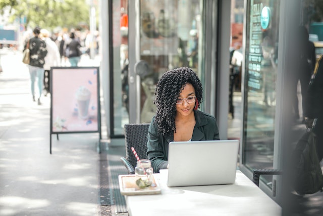 An influencer sealing a TikTok paid partnership deal on her laptop.