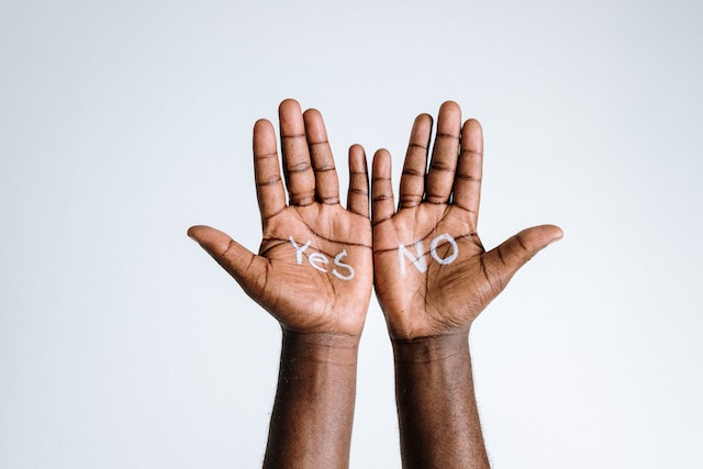 “Yes” and “No” written on someone’s palm.