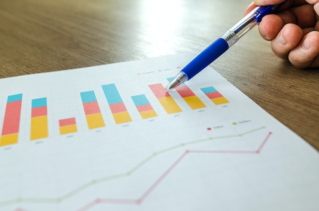 A person studies graphs representing TikTok growth.