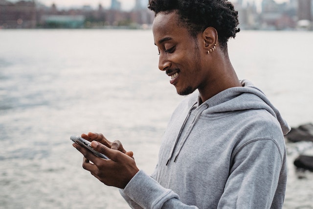 An influencer downloading videos via a TikTok videos downloader.