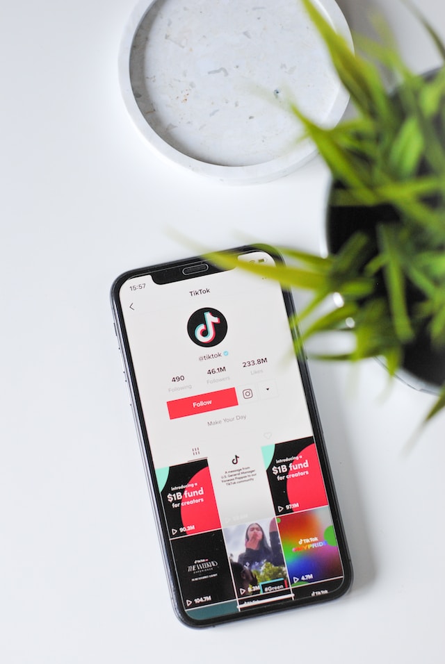 A picture of a phone showing TikTok’s official account on the app with over 46 million followers.