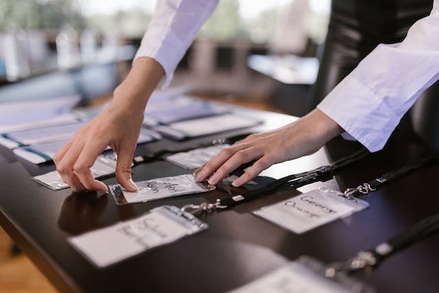 An image of a person sorting name tags. 
