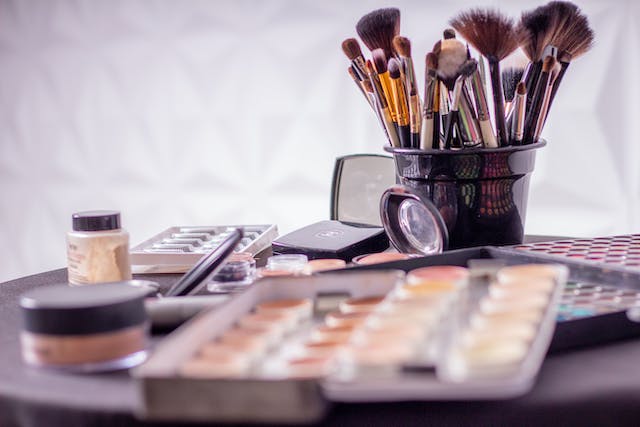 A photo of various makeup products on a table. 