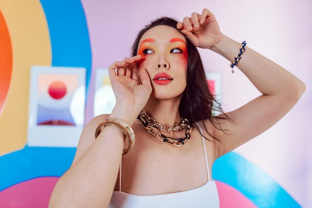 A woman poses for the camera to show off her makeup. 