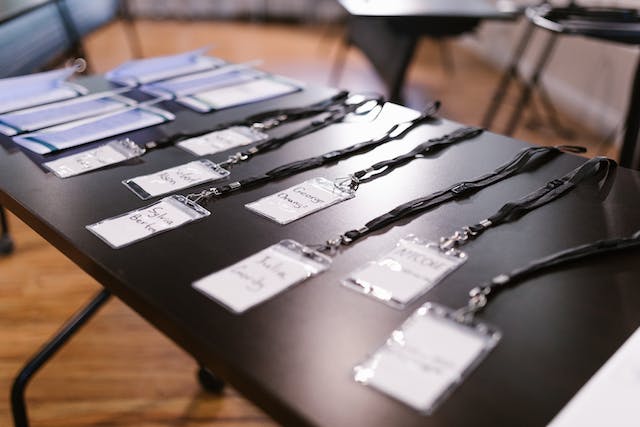 A photo of ID cards arranged on a table. 