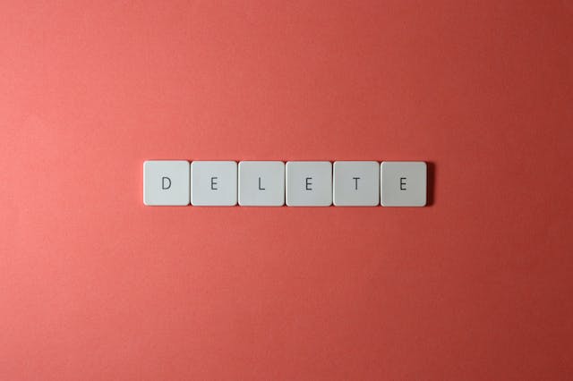 White letter tiles spell the word “Delete.”
