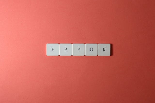 White letter tiles spell the word “Error.”