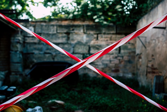 Red and white tapes block off an area. 
