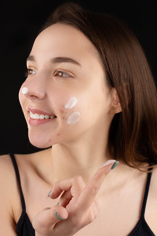 A woman wearing face cream.
