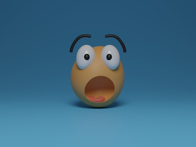 A 3D yellow emoji with a surprised face. 
